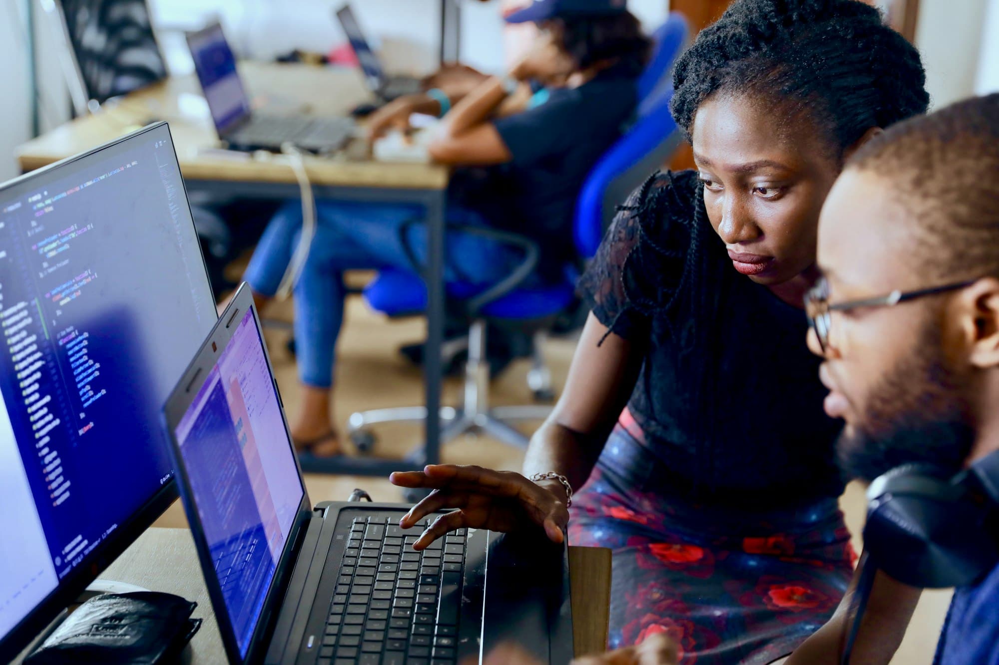 Nexorra engineers reviewing code together
